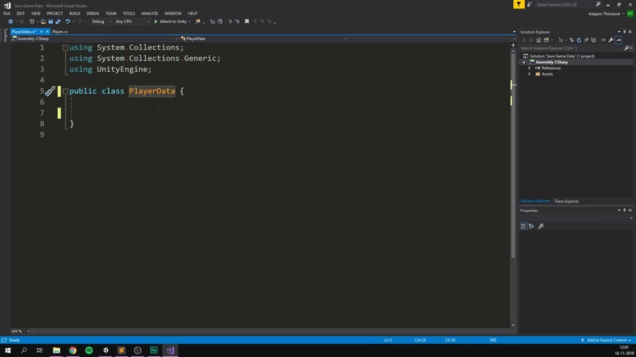 Visual Studio is open with the PlayerData.cs script in the editor and the Solution Explorer panel on the right.